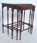 A good Edwardian mahogany inlaid nest of tables. Each raised on turned legs with peripheral