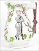 A 19th century Staffordshire Crimean war jug with trunk and lion mask handles and soldiers and trees