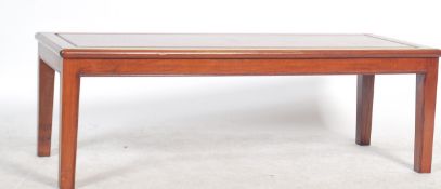 A good Chinese hardwood rectangular coffee occasional table  raised on reeded squared legs with