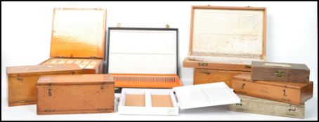 A good collection of 19th and 20th century microscope slide boxes of various shapes and sizes.