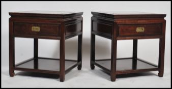 A good pair of Chinese hardwood side tables, each raised on reeded squared legs with single frieze