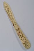 A 19th century Napoleonic prisoner of war bone carved model of a pen knife having a pierced blade