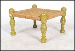 An early 20th century middle eastern Pakistani wooden foot stool of square form having a painted