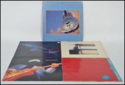 A group of five long play LP vinyl records by Dire