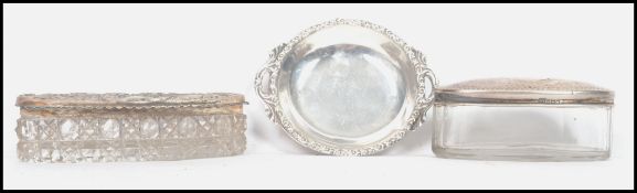 A silver 900 stamped pin dish with stylised border and open handles along with a silver hallmarked