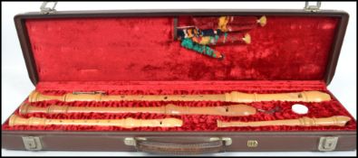 Musical Instruments: A cased compendium set of fruitwood recorders by Erich Hellinger, in a fitted