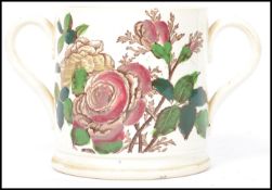 A 19th century Victorian transfer and hand painted twin handled loving cup with 1 Quart notation and