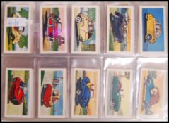 Cigarette / Trading Cards: An album of assorted vintage tea trading cards, all complete sets. From a