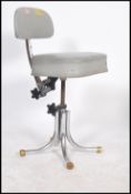 A vintage 20th century retro industrial office swivel chair in the manner of Tansad raised on a