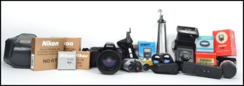A group of vintage photography equipment to include a Nikon N70/F70 SLR and lens, Boxed flashed,