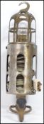 An original early 20th century Joseph Lucas trouble / cage inspection lamp with polished steel and