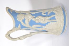 A 19th century Dale Hall Longport ceramic ewer jug having a white and blue ground moulded in
