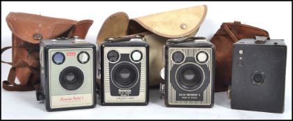 A collection of 4 Kodak box brownie camera's and cases ( various models to include model 1, SIX20