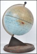 A mid 20th century desk top tin globe by Chad Valley having a sundial base. Measures: 28cm high x