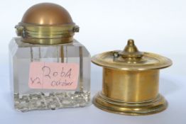 A 19th century campaign / partners Indian brass inkwell of roundel form having a flared rim and base