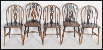A set of 4 20th century country oak wheelback dini