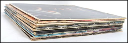 A collection of twelve vinyl long play LP records all relating to The Rolling Stones to include