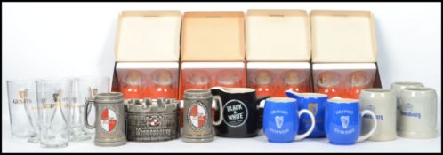 A collection of vintage breweriana collectable Guinness advertising items to include Kronenbourg