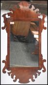 A 19th century mahogany pier mirror / Swansea mirror having a central mirror panel housed in an open