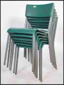 A set of six vintage 20th century tubular metal and vinyl stacking chairs in the manner of James