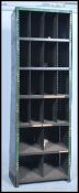 A slim original mid 20th century Industrial large green enamel metal sectional cubby cabinet. The