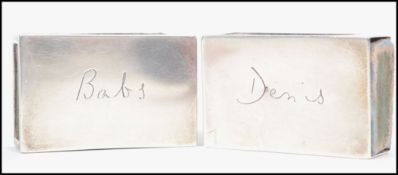 A matching pair of George V silver hallmarked matchbox holders of plain form having hallmarks for