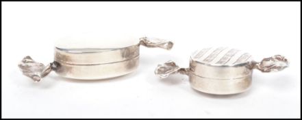 Two vintage 20th century silver pill boxes in the form of boiled sweets with stylised wrapper
