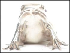 An Edwardian silver hallmarked novelty pin cushion by Adie and Lovekin the form of a Frog with