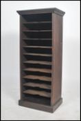 A late 19th century Industrial oak office filing cabinet of pedestal form with plinth base housing