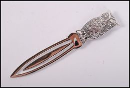 A sterling silver novelty book mark clip with owl finial to top.Weighs 8.8 grams.