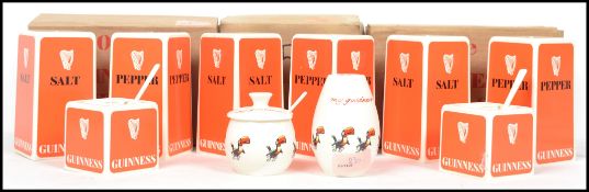 A collection of vintage commemorative collectable Guinness advertising items to include three