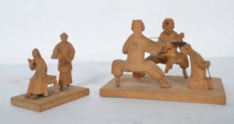 Two Chinese early 20th century hard wood carved groups - dioramas one of a beheading and the other