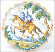 A large 20th century Faience  charger plate of Spanish origin having horse with soldier design being