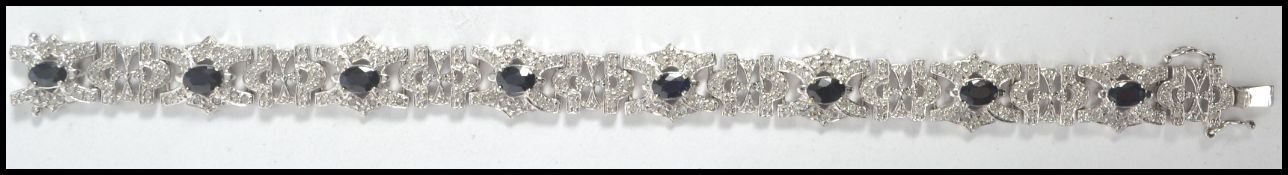 A stunning 18ct white gold, sapphire and diamond ladies bracelet. The diamond encrusted links with