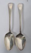 A pair of Georgian Old English pattern table spoons, hallmarked with assay mark for London, dating