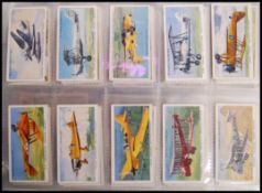 Cigarette Cards: An album of assorted vintage cigarette cards - all full sets. From a large