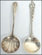 A silver hallmarked caddy spoon strainer with pierced bowl being hallmarked for James Dixon &