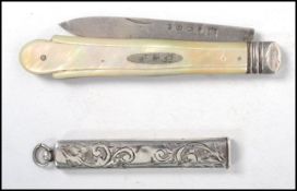 A 19th century silver hallmarked penknife of larger form having a shaped monogrammed mother of pearl