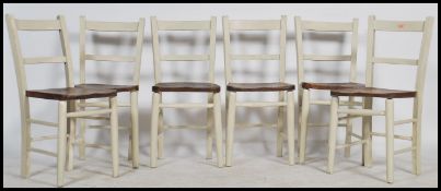 A set of 6 19th century beech and elm shabby chic painted country dining chairs. Raised on turned