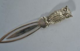 A sterling silver paperclip / bookmark having an owl finial handle marker, stamped 925 Weighs.8.7