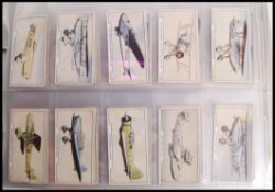 Cigarette Cards: An album of assorted vintage cigarette cards - all full sets. From a large