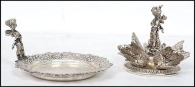 An Italian silver plated miniature centre piece having a foliate swirl border with central five