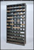 An original mid 20th century Industrial large green / ebonised enamel metal sectional cubby cabinet.