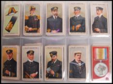 Cigarette Cards: An album of assorted vintage cigarette cards - all odd cards or part sets. From a