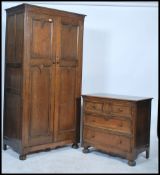 A Jacobean style bedroom suite to include a oak double wardrobe, the two panelled doors opening to