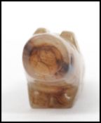 A good early 20th century Chinese carved jade lion - temple fu dog incense stick holder being of low