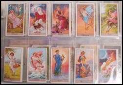 Cigarette Cards: An album of assorted vintage cigarette cards - all odd cards / part sets. From a