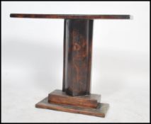 A 1930's Art Deco / early 20th century stained pine console table having a tapering boat shaped