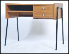 A 1970's unusual teak effect and tubular metal desk issued for the MOD having open recess with