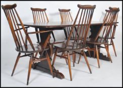 A set of six Ercol Elm and beech stick back dining chairs two being carvers together with an Ercol